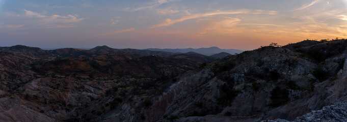Panoramic view of a mountainous landscape at sunset