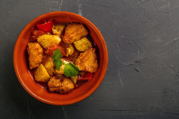 Food for suhoor in ramadan lamb stew with potatoes on a gray background.