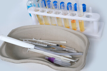 antigenic test cassette, glass test tubes with reagents, conducting a rapid test covid-19 in a medical laboratory, concept of early detection of a viral disease