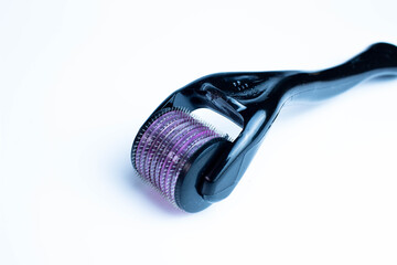 Derma roller: Micro needles for scalp treatment, hair growth therapy against white backgorund isolated