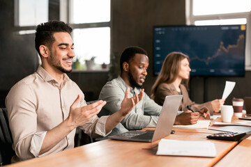 Man in medical mask having video call talking with client