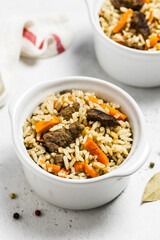 Healthy meal, oven baked r rice and meat in pots. Space for text.