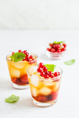 Summer cold refreshing cocktails, berry iced tea in glasses. Space fot text.