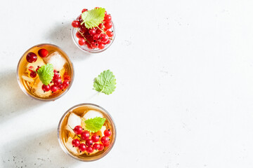 Summer berry iced tea in glasses. Space fot text, top view.