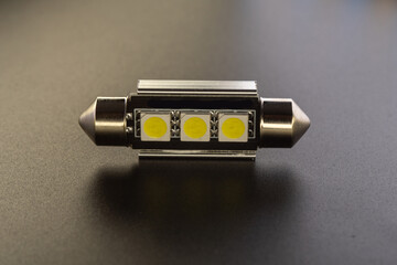 Lot of Car light bulbs emitting diode, accessories and components for electronics vehicles. Modern technologies and low energy consumption concept. Black background close-up view. 12V c5w w5w