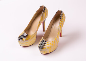 Women shoes made of python skin. High-heeled shoes. A pair of high-heeled shoes. Beautiful women...