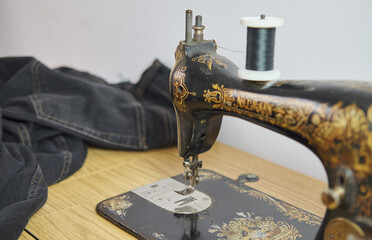 Close-up of a vintage hand sewing machine. Selective focus.