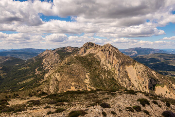 Mountain in the interior of the province of Alicante (Spain), called Mallada del Llop, on an afternoon with sun and clouds.