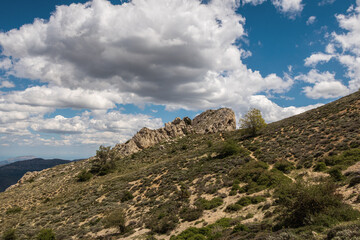 Fototapeta na wymiar Mountain in the interior of the province of Alicante (Spain), called Mallada del Llop, on an afternoon with sun and clouds.