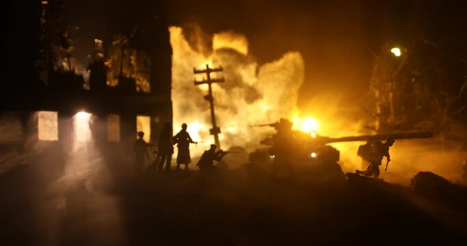 War Concept. Military silhouettes fighting scene on war fog sky background, World War Soldiers Silhouette Below Cloudy Skyline At night. Battle in ruined city. Selective focus