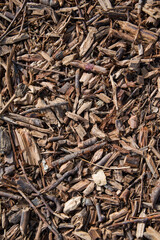 Natural background of wood chips forming a useful layer for horticulture.
