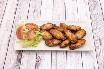 chicken wings with salad