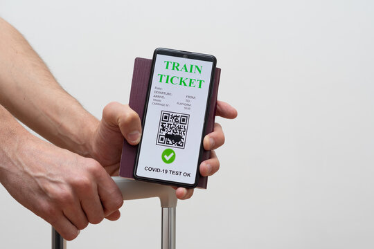 vaccinated person using digital health passport app in mobile phone for travel during covid-19 pandemic on train and passport. green certificate