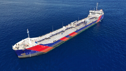 Aerial drone photo of crude oil tanker carrier anchored in deep blue open ocean sea