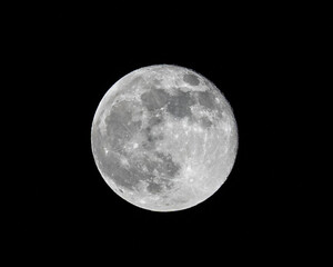 Obraz premium Super moon from northern hemisphere in Switzerland. Astronomical event on 27. April 2021.