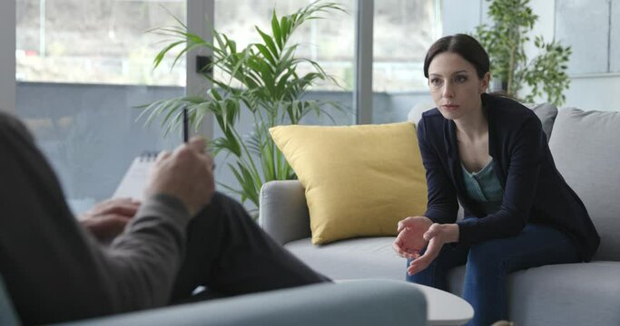 Young woman talking with a professional therapist