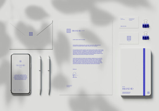Top View of Stationery Set and Smartphone Mockup