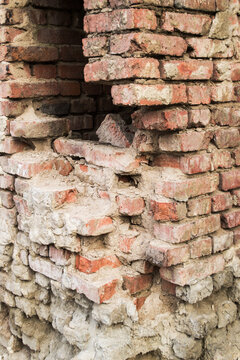 Destroyed brick wall. The foundation of the old building.