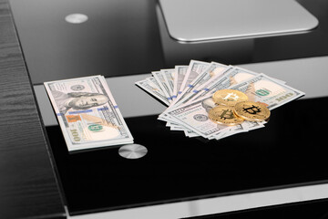 golden bitcoin coin on us dollars close up. Electronic crypto currency