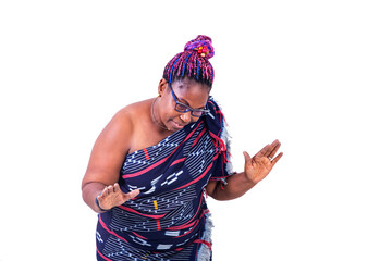portrait of a beautiful African woman in traditional dress dancing, smiling.