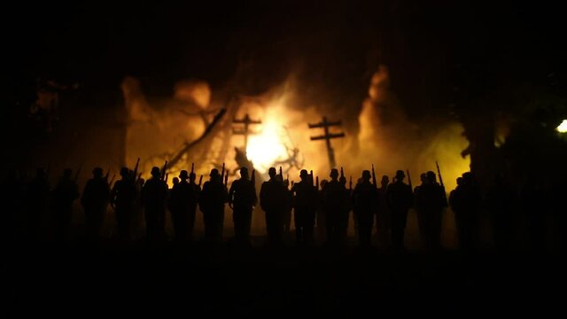 War Concept. Military silhouettes fighting scene on war fog sky background, World War Soldiers Silhouette Below Cloudy Skyline At night. German soldiers in ranks. Selective focus