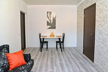 Modest living room interior. Modern minimalism with loft elements