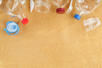 Fototapeta na wymiar Plastic garbage from the sea on a sandy beach.