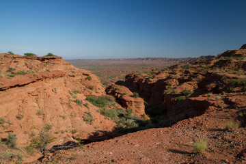 Arid landscape. View of the desert red canyon, orange sandstone cliffs, precipice and rocky mountains in Sierra de las Quijadas, national park.