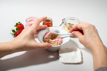 Woman hands making homemade cosmetics.