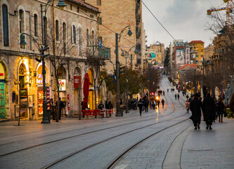 Fototapeta premium Jerusalem, Israel. 8 January, 2019. Central street of Jerusalem, big houses, tram, people, cafes and shops