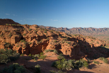 Prehistoric cliffs in Sierra de las Quijadas National Park, San Luis, Argentina. Arid desert landscape. Red sandstone canyon and valley.