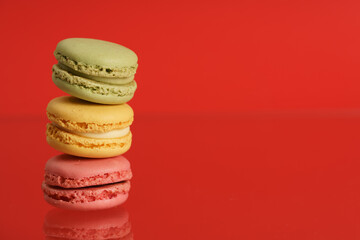 Colorful french macarons on background