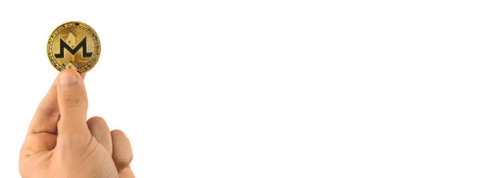 Monero coin in hand banner isolated on white background, copy space photo