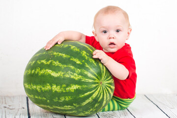 Little boy with big watermelon