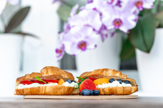 breakfast, croasant filled with vanilla cream and fruit