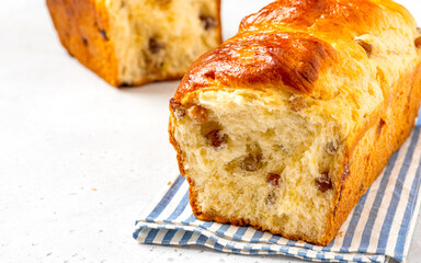 Homemade cake closeup. Sweet cake from yeast dough with raisins. Homemade baking.