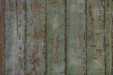 abstract background of an old shabby painted light green wooden surface close up