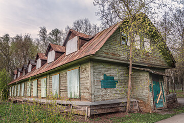 abandoned old wooden house with clogged windows and doors