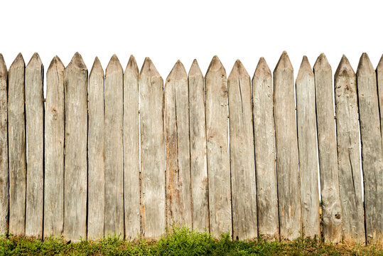 Wooden fence from logs isolated on white background. Fence from a stockade fence on white