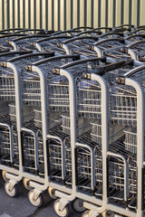 Shopping carts in a row outside a store