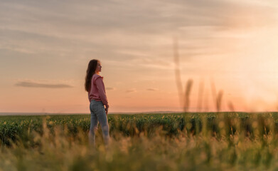 Fototapeta na wymiar Beauty young girl outdoors enjoying nature, sunset