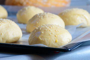 Home baking artisan brioche burger buns. Cooking bread.