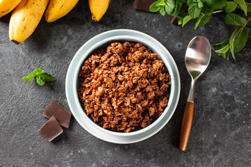 Healthy chocolate banana oatmeal for breakfast. selective focus. Top view