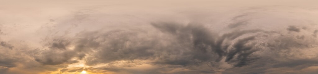 Overcast sky panorama on sunset with Cumulus clouds in Seamless spherical equirectangular format as full zenith for use in 3D graphics, game and aerial drone 360 degree panoramas for sky replacement.
