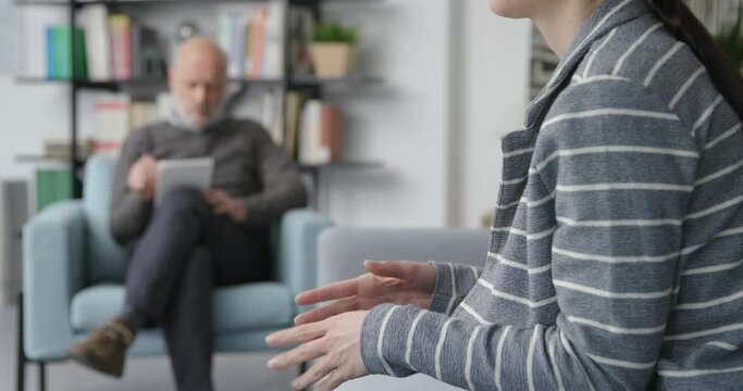 Professional therapist listening to a patient