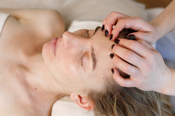 woman on a facial massage. anti-ageing procedures