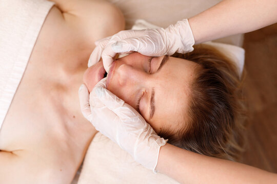 buccal massage. anti-ageing procedures. woman's face
