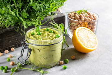 Healthy avocado hummus and green pea with olive oil. Vegetarian concept