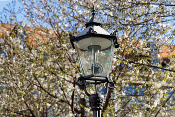 a historic gas lantern converted to electricity in the city of Leipzig