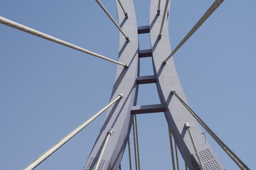 Shot of elements of modern bridge with blue sky on the background